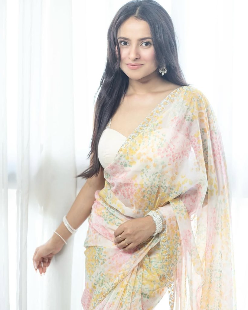 Aarushi Baruah wearing elegant white transparent saree in photoshoot