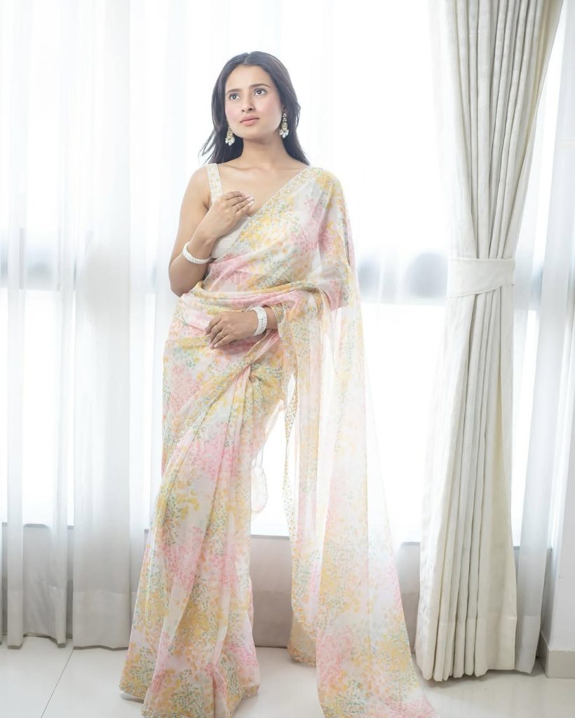 Aarushi Baruah wearing elegant white transparent saree in photoshoot
