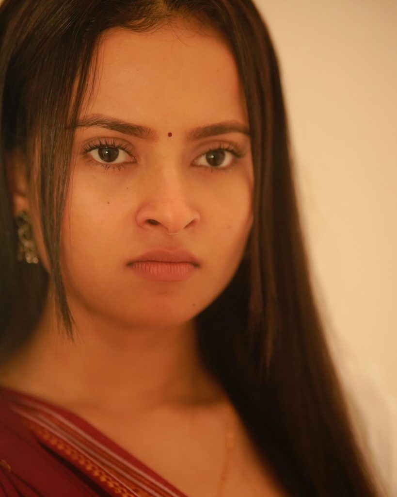 Aarushi Baruah wearing beautiful maroon saree in cute photoshoot