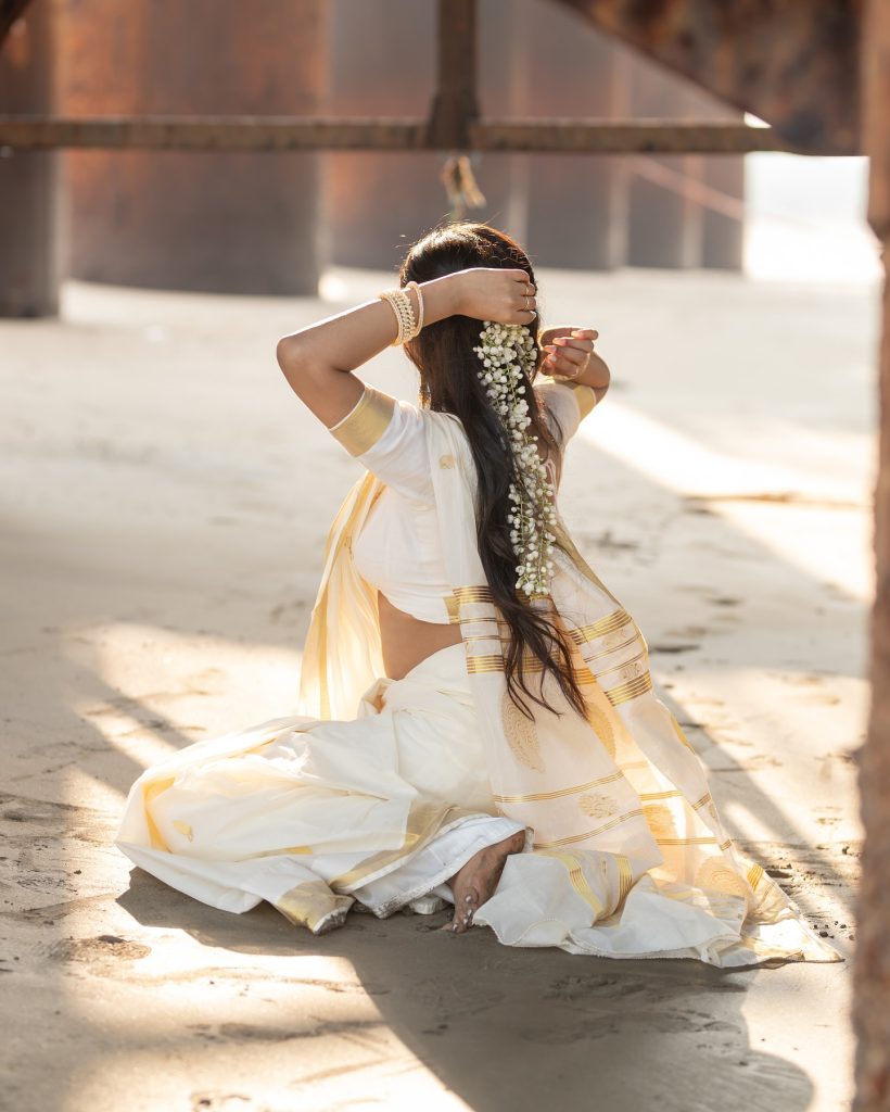Close-up of Aarushi Baruah's makeup and styling with white saree
