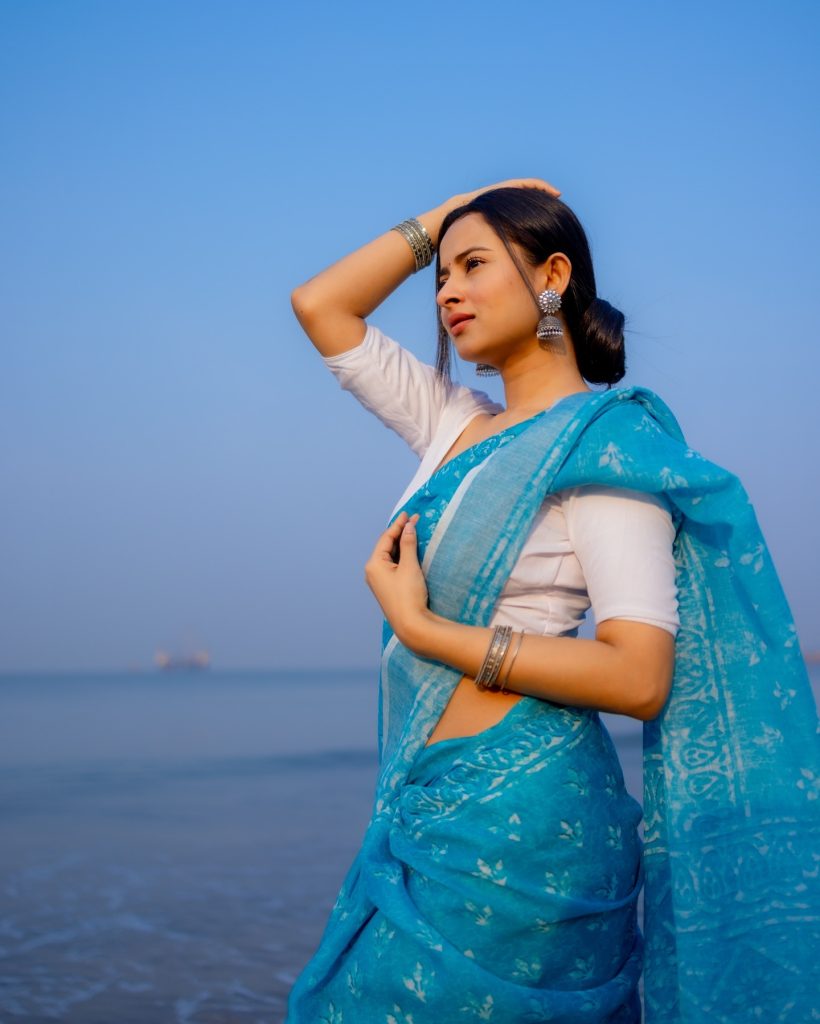 Aarushi Baruah wearing blue saree in beautiful beach photoshoot