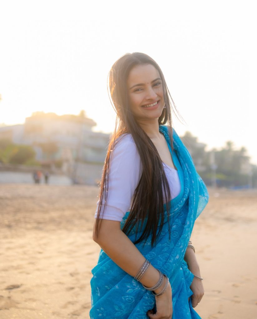 Aarushi Baruah wearing blue saree in beautiful beach photoshoot