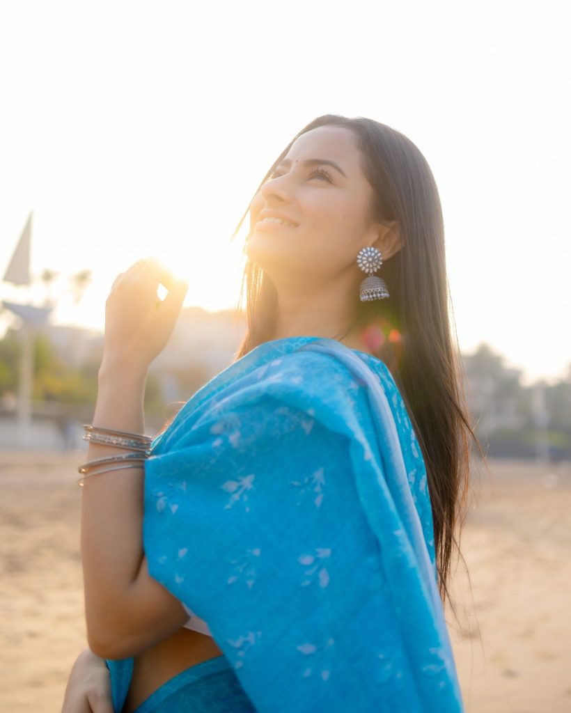 Aarushi Baruah wearing blue saree in beautiful beach photoshoot