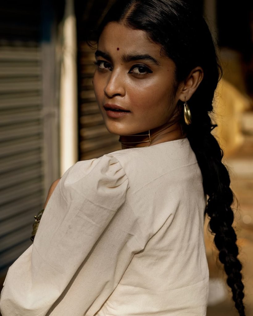 Chaithra J Achar wearing elegant white dress in casual photoshoot