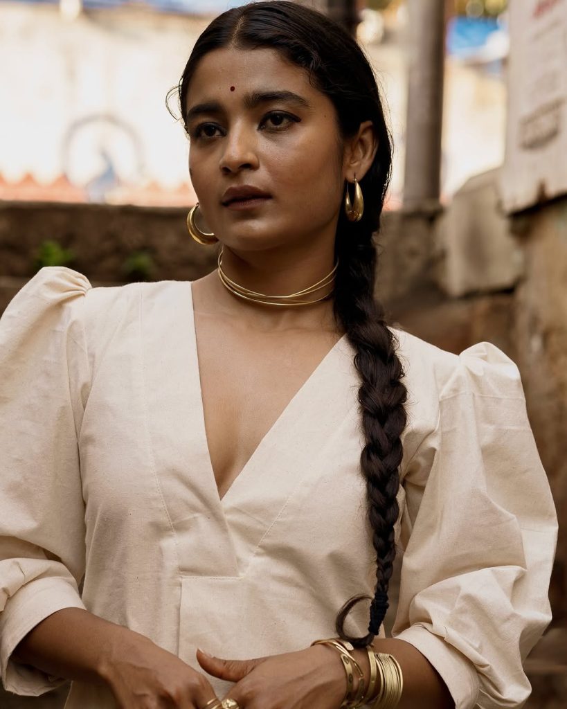 Chaithra J Achar wearing elegant white dress in casual photoshoot