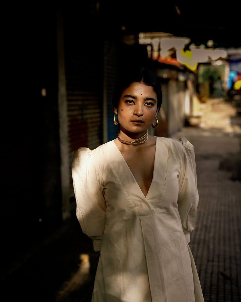 Chaithra J Achar wearing elegant white dress in casual photoshoot