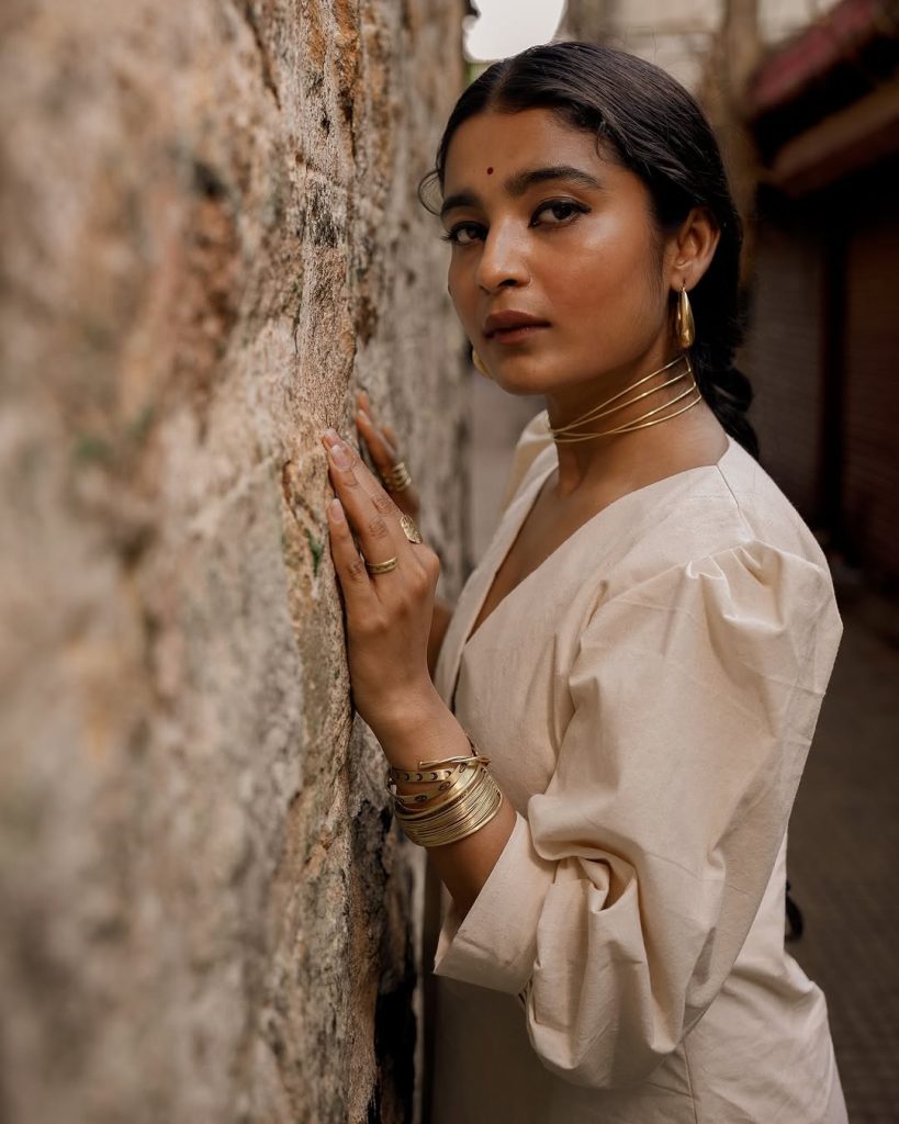 Chaithra J Achar's natural makeup with white dress styling