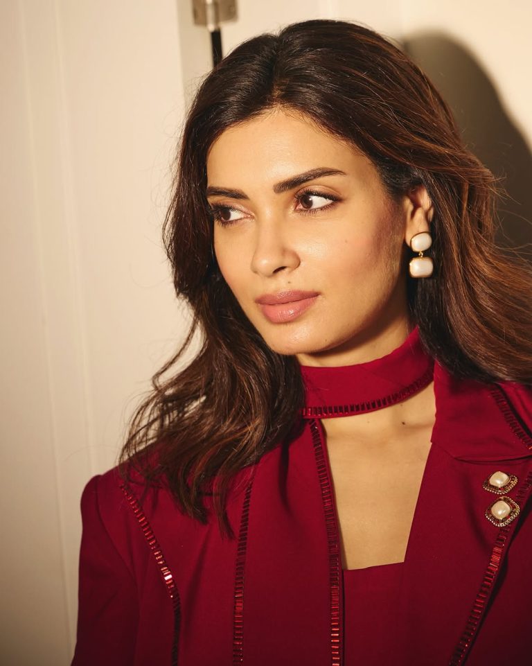 Diana Penty wearing striking red outfit in professional photoshoot