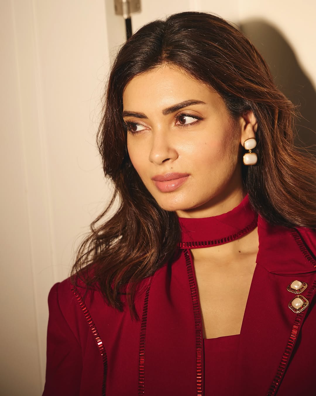 Diana Penty wearing striking red outfit in professional photoshoot