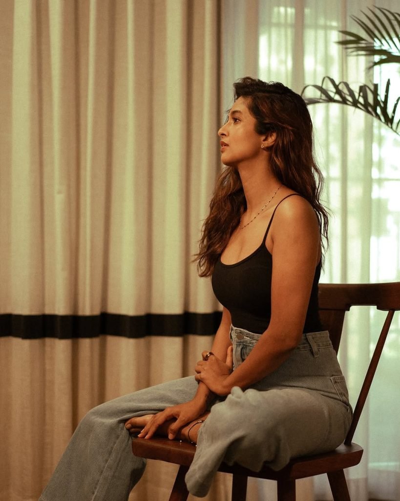 Keerthi Pandian looking cute while posing casually on comfortable couch