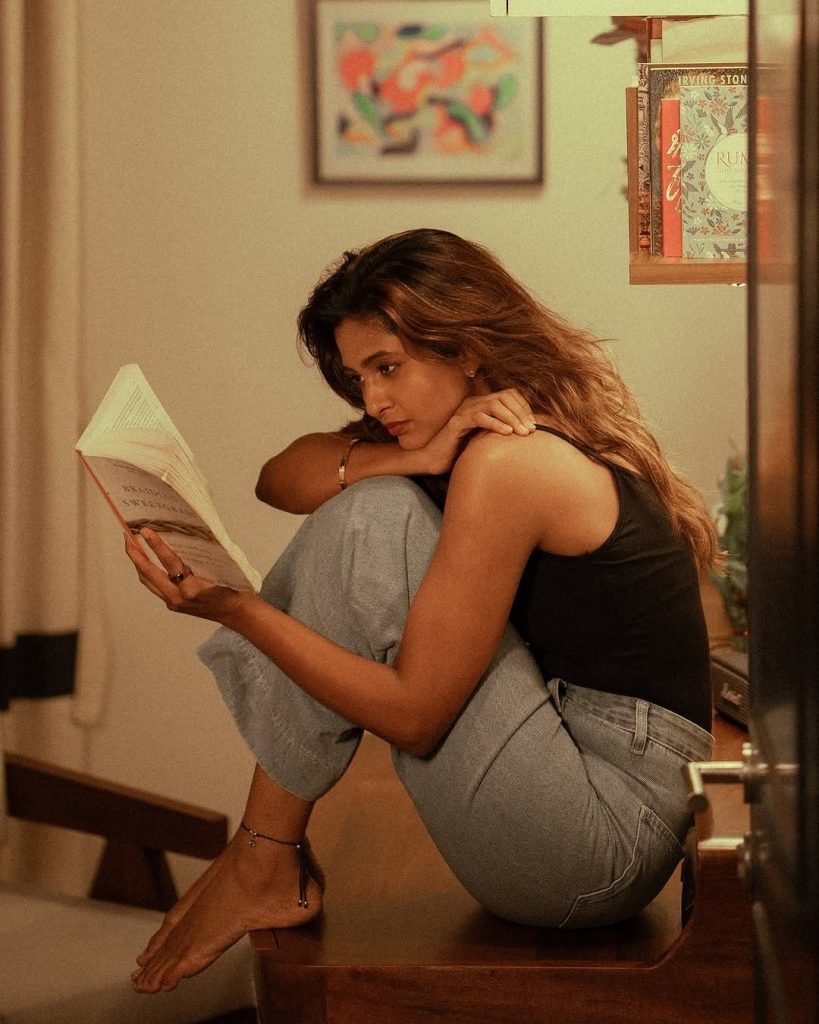 Keerthi Pandian looking cute while posing casually on comfortable couch