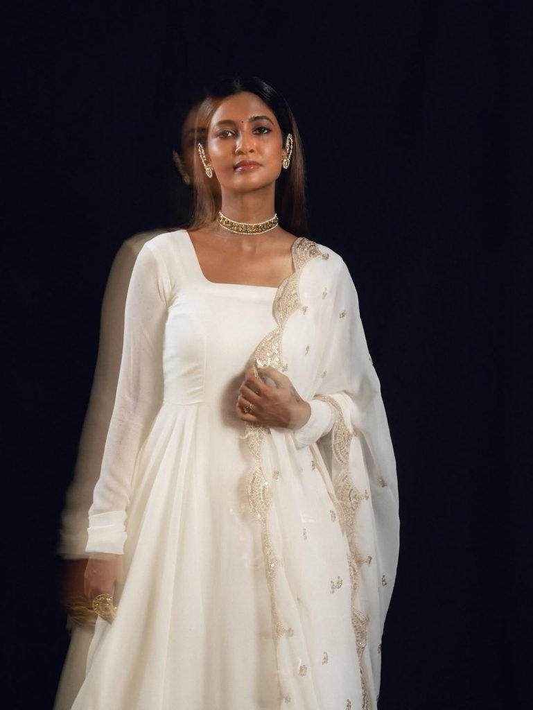 Keerthi Pandian wearing elegant white dress in stunning photoshoot