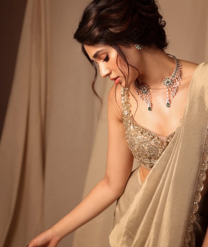 Kriti Shetty posing gracefully in colorful lehenga