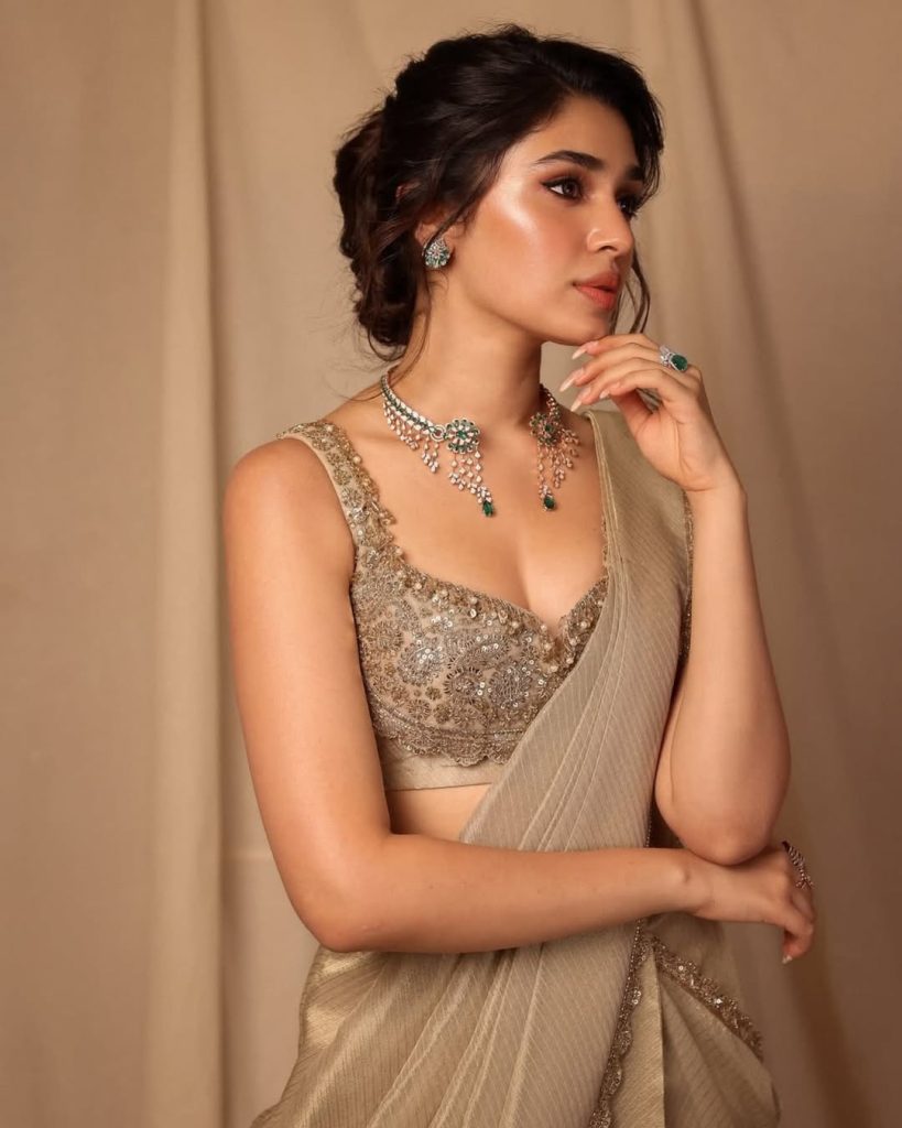 Kriti Shetty posing gracefully in colorful lehenga