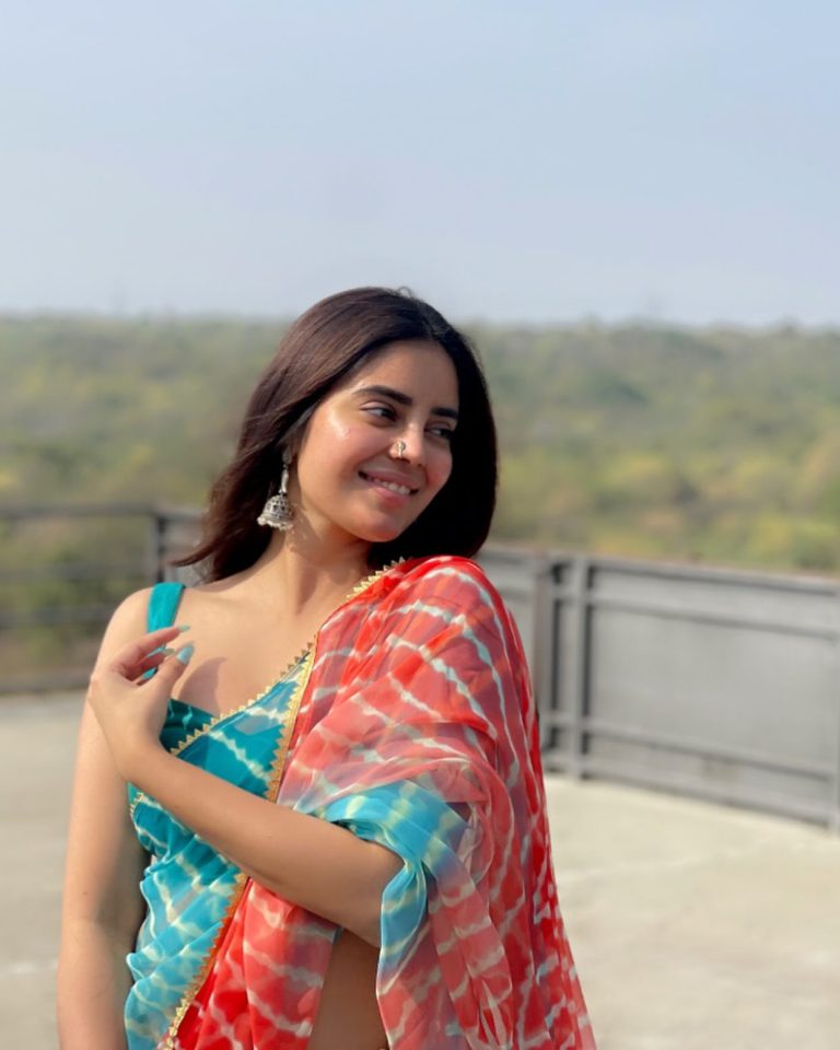 Kushitha Kallapu wearing elegant blue saree in traditional photoshoot