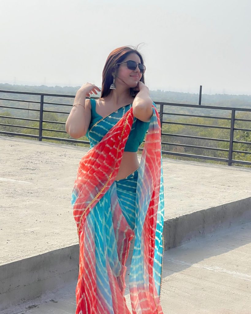 Kushitha Kallapu wearing elegant blue saree in traditional photoshoot