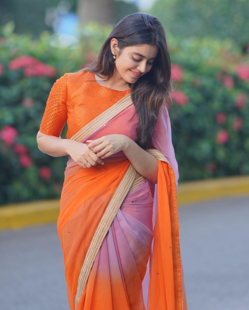 Actress Kushitha Kallapu glamorous poses in park wearing orange saree