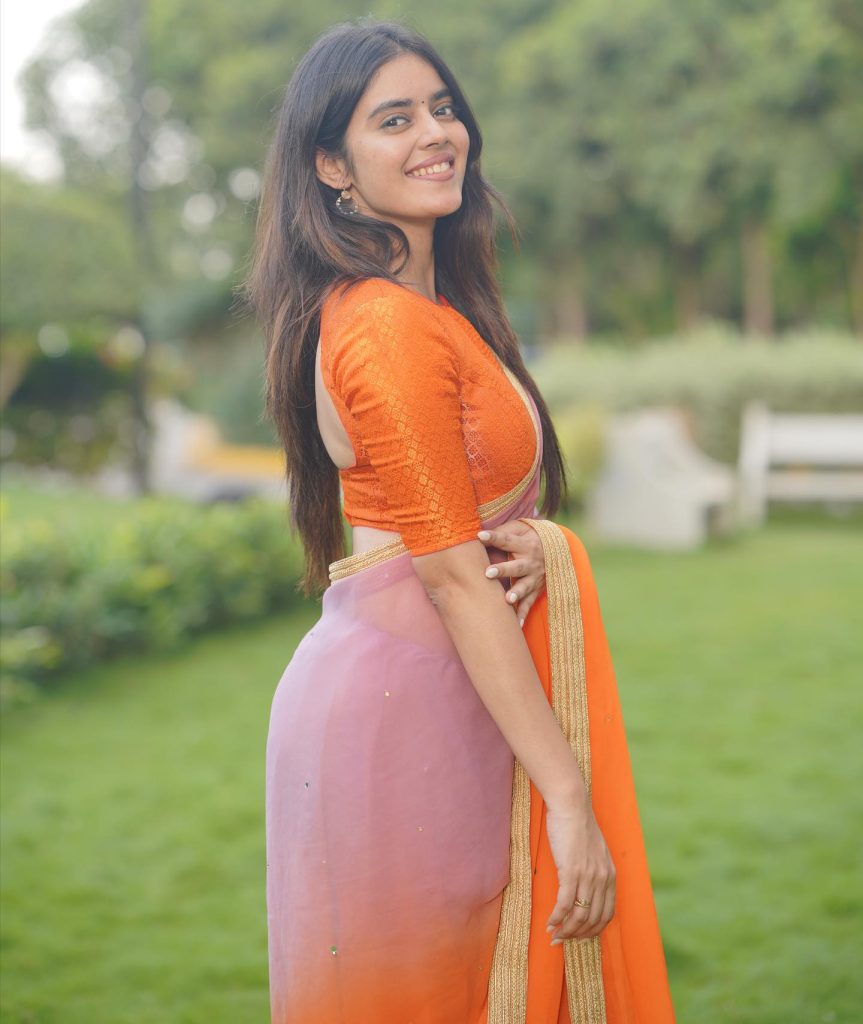 Kushitha Kallapu hot orange saree photoshoot in park