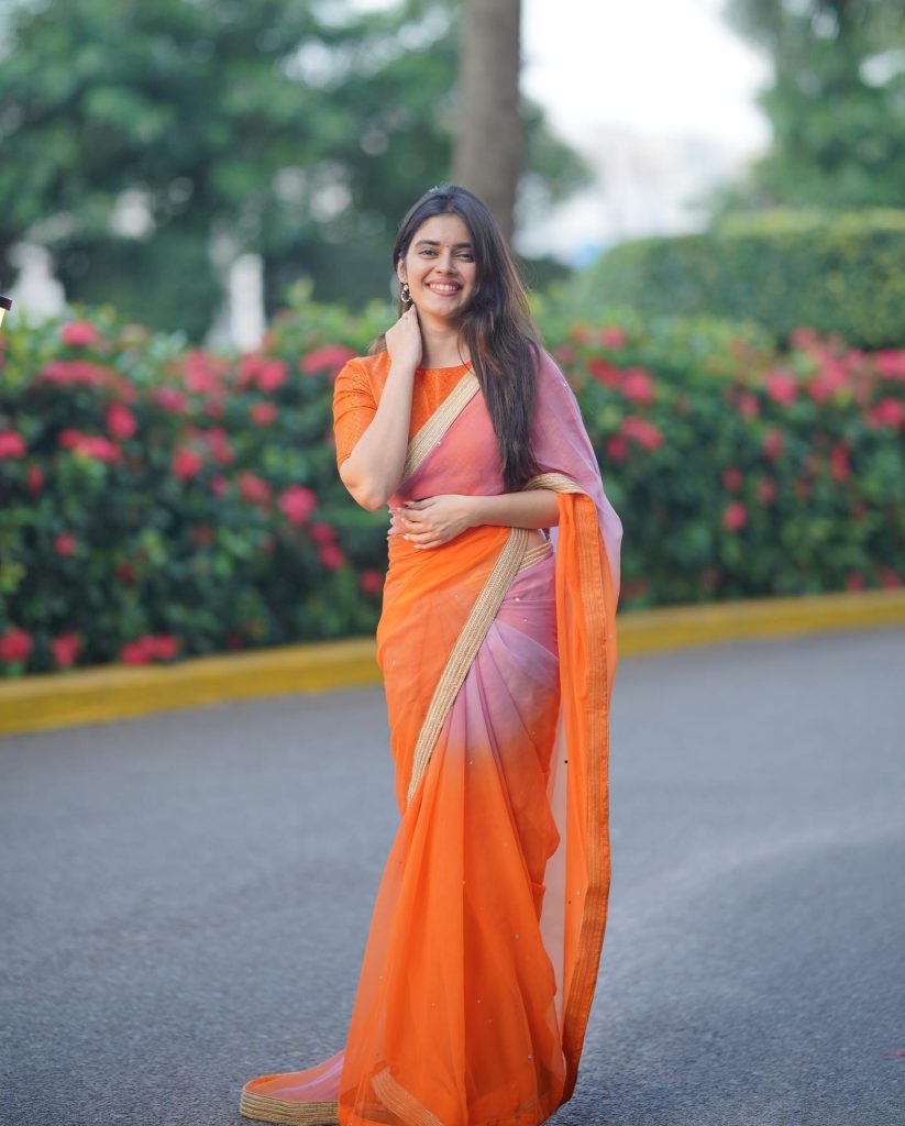 Kushitha Kallapu bold look in orange saree outdoor photos