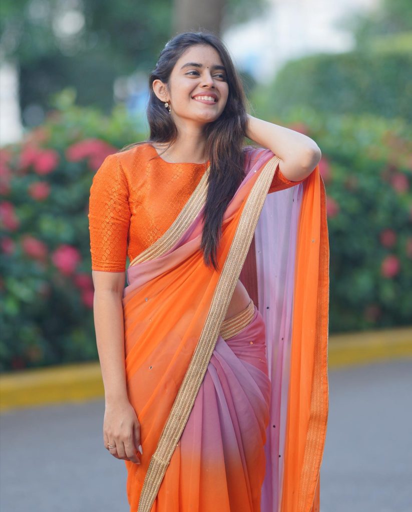 Actress Kushitha Kallapu glamorous poses in park wearing orange saree