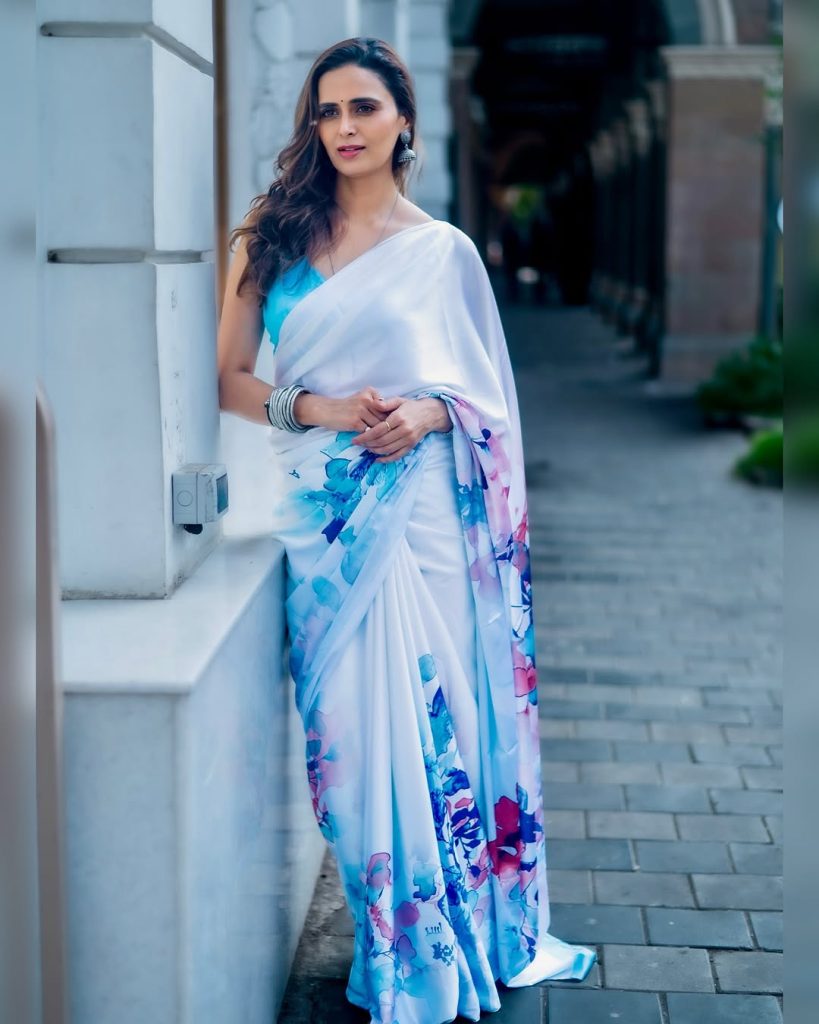 Meenakshi Dixit wearing elegant white saree in traditional photoshoot