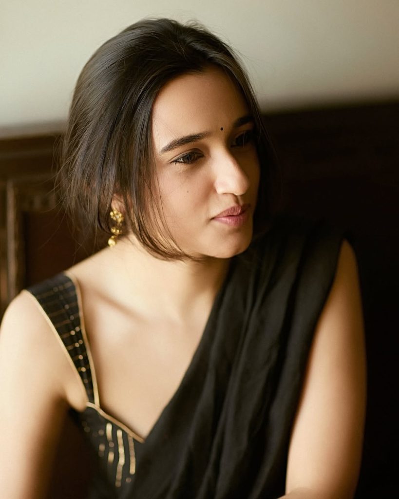 Nuveksha's complete black saree hot styling