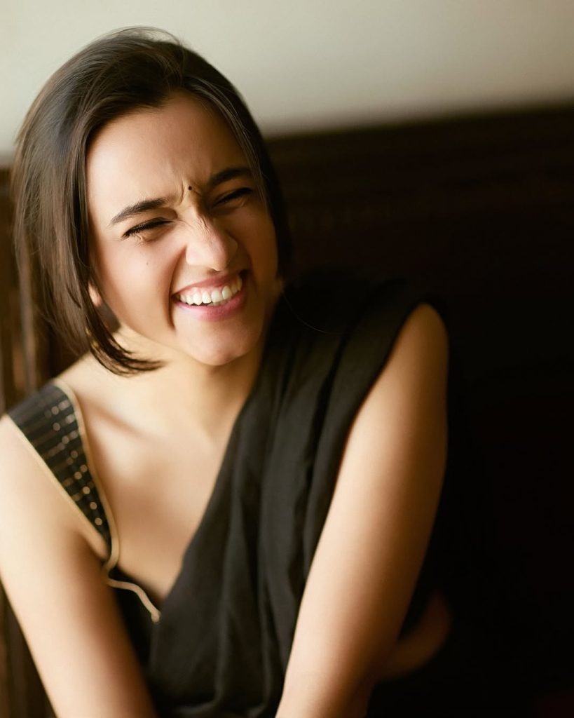 Nuveksha posing elegantly in sophisticated black saree