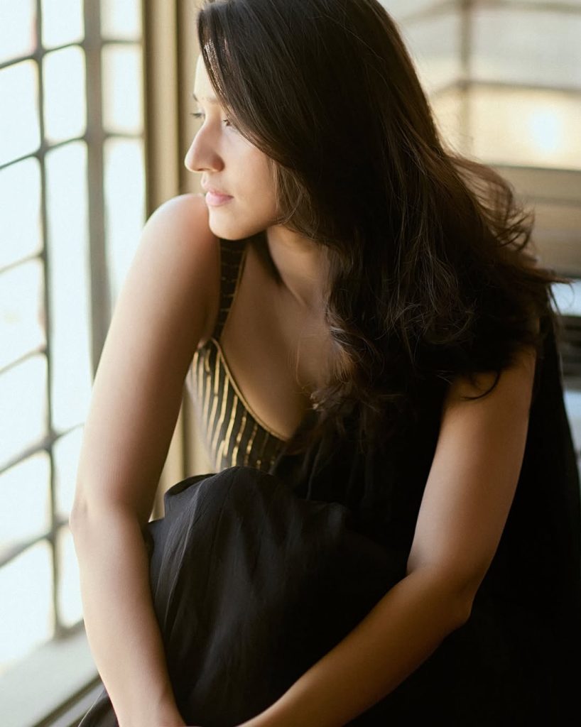 Nuveksha wearing stunning black saree in glamorous photoshoot