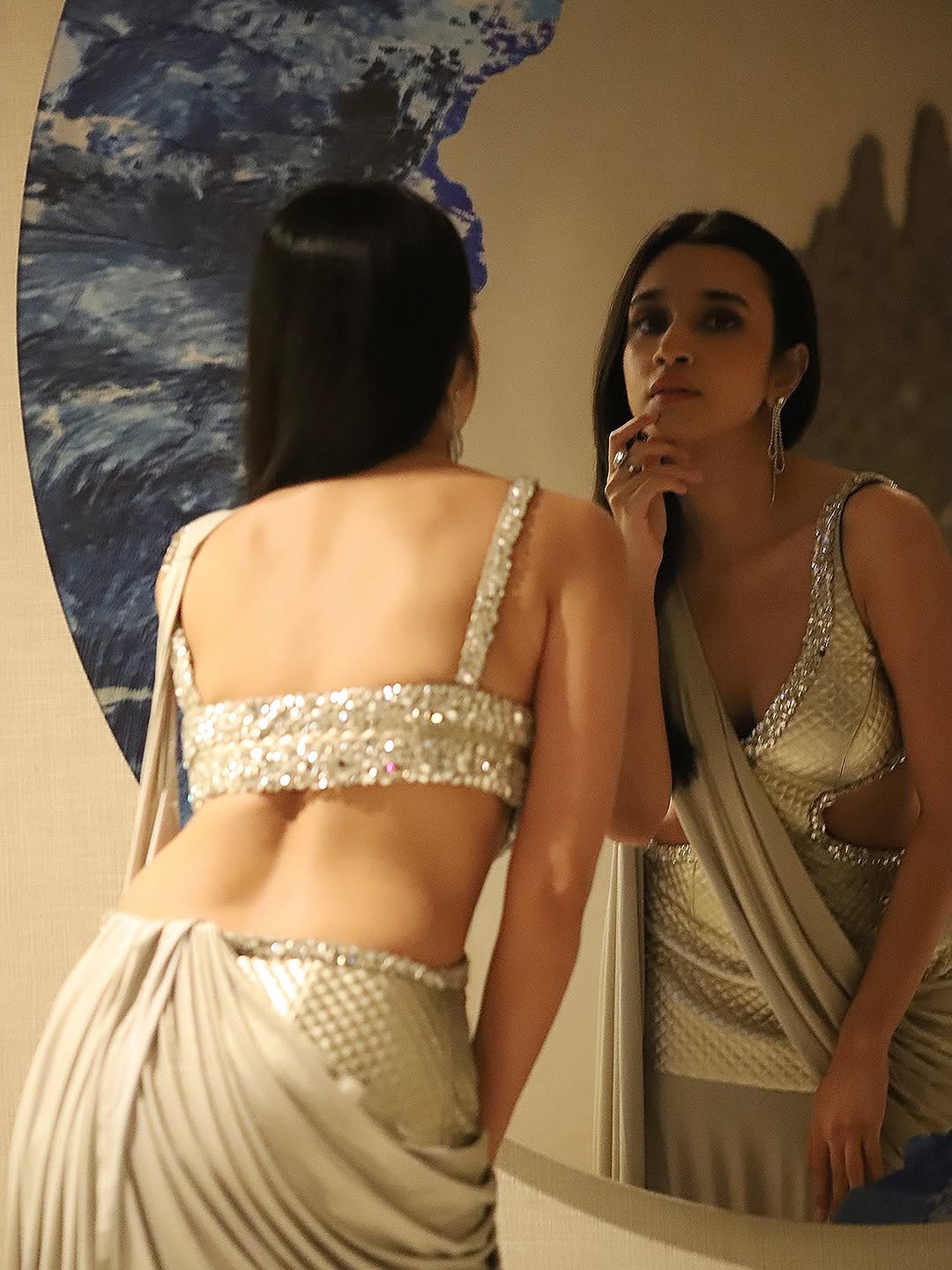 Nuveksha posing confidently in complete party look