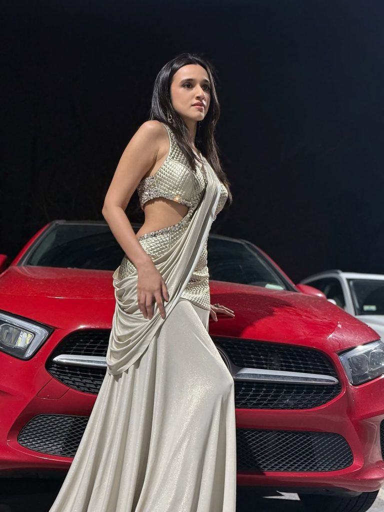 Nuveksha posing confidently in complete party look