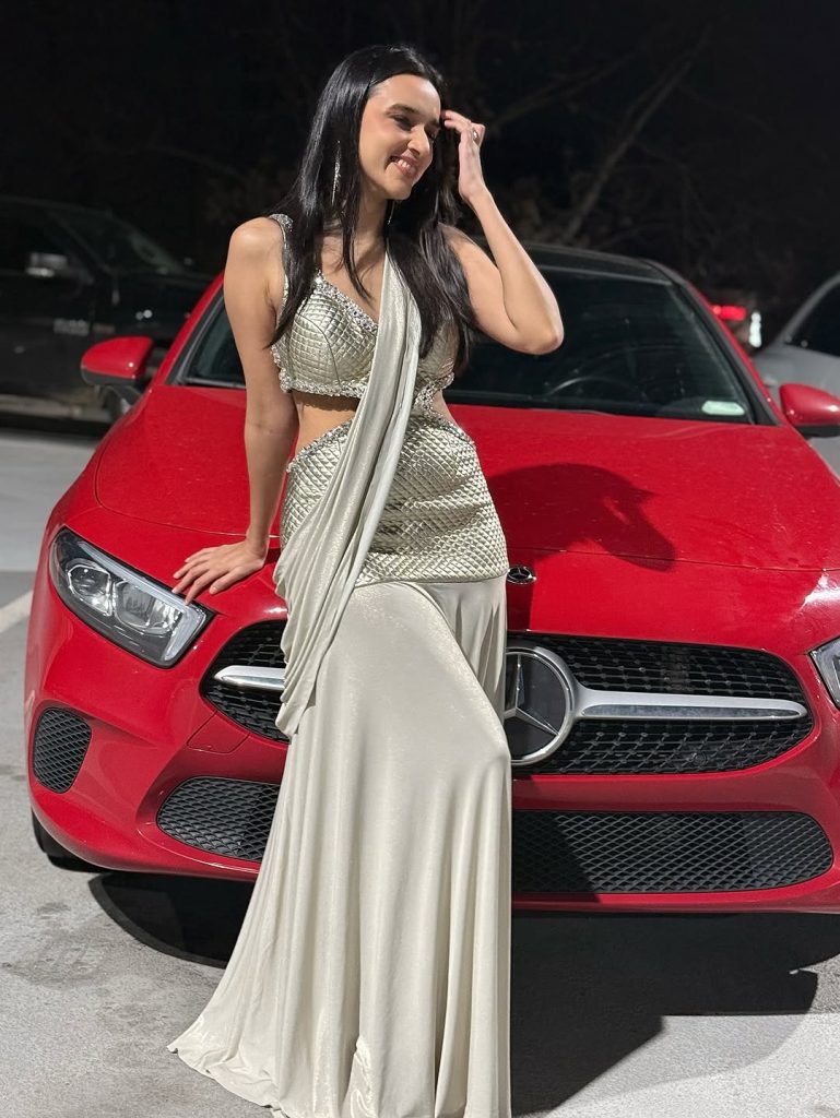 Nuveksha posing confidently in complete party look