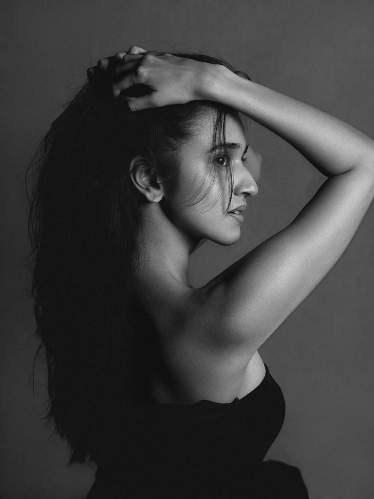 Nuveksha posing artistically in black and white fashion ensemble