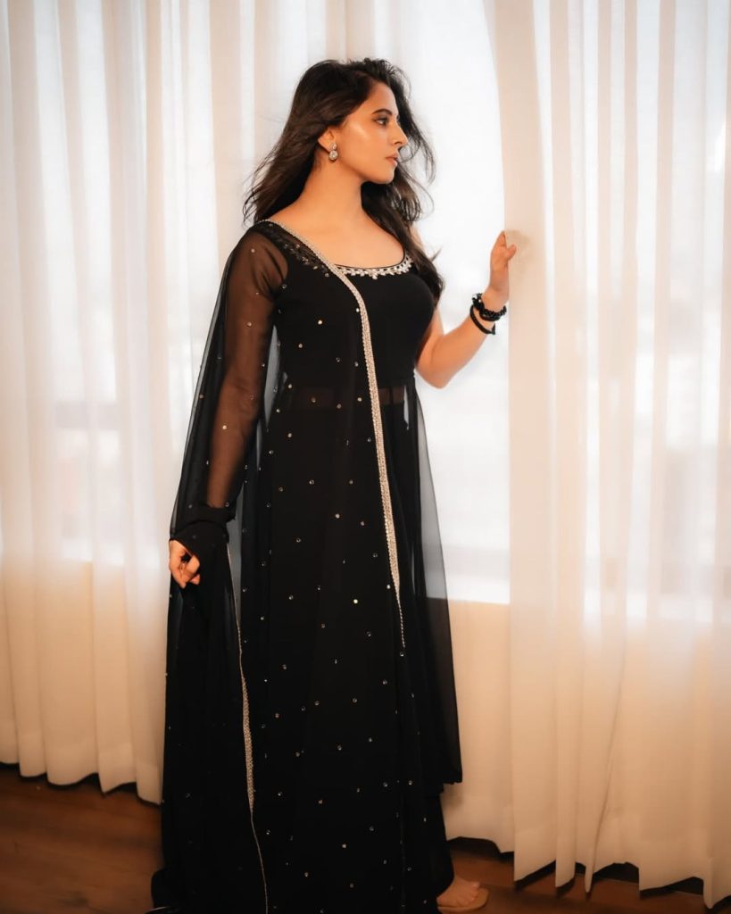 Preethi Asrani wearing sophisticated black dress in glamour photoshoot