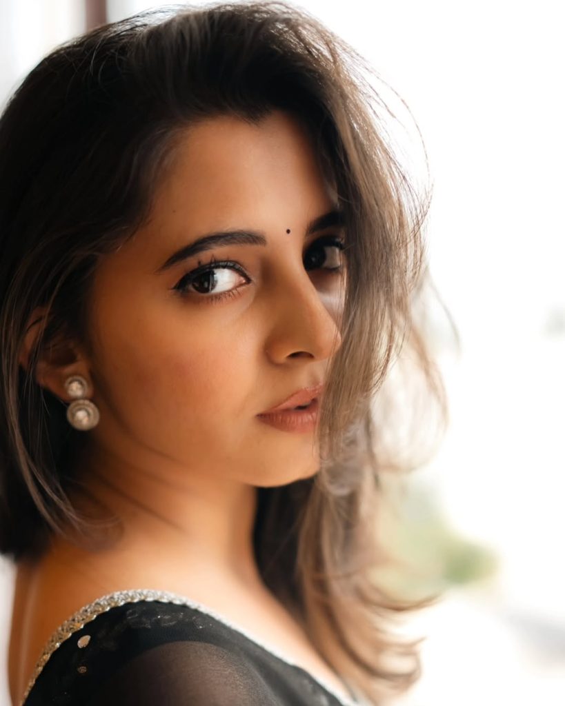 Preethi Asrani wearing sophisticated black dress in glamour photoshoot
