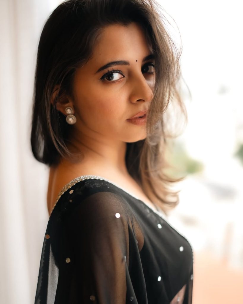 Preethi Asrani wearing sophisticated black dress in glamour photoshoot