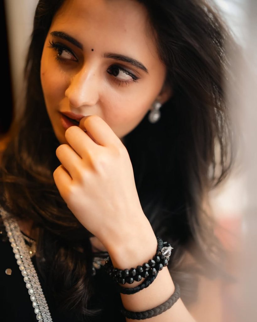 Preethi Asrani wearing sophisticated black dress in glamour photoshoot