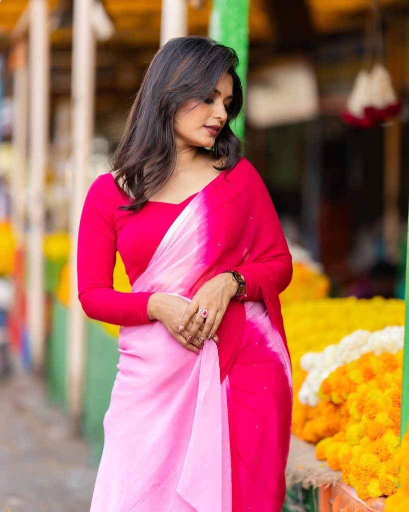 Priyanka Jain wearing beautiful pink saree with traditional styling