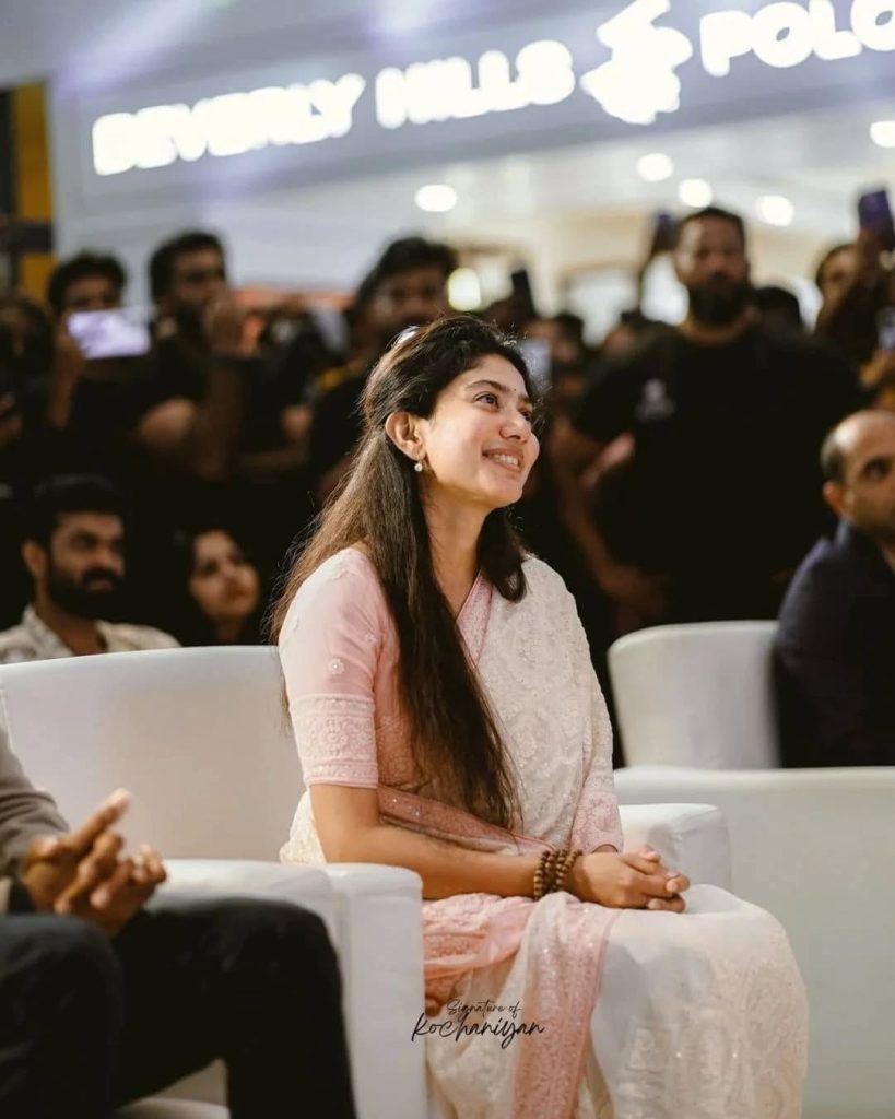 Sai Pallavi posing charmingly at Amaran film promotion event