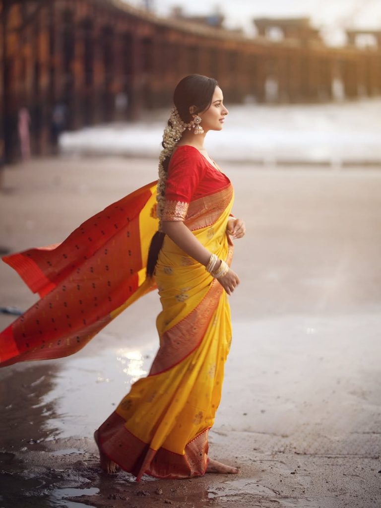 Golden yellow fabric creates luminous effect against Aarushi Baruah's soft lighting