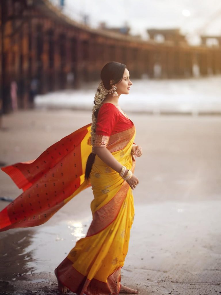 Golden yellow fabric creates luminous effect against Aarushi Baruah's soft lighting