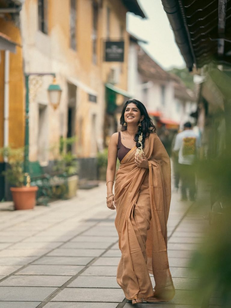 Casual saree draping highlights Anagha Ajith's natural comfort with traditional wear