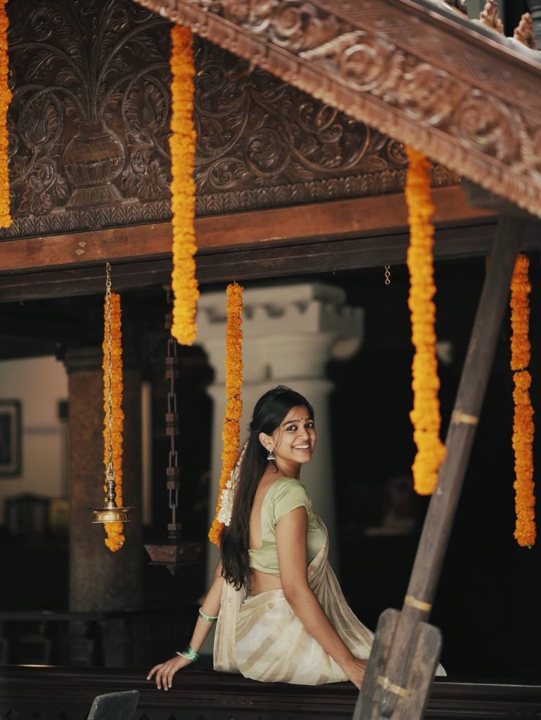 Festival white saree styling captures Ananthika Sanilkumar's cultural celebration spirit