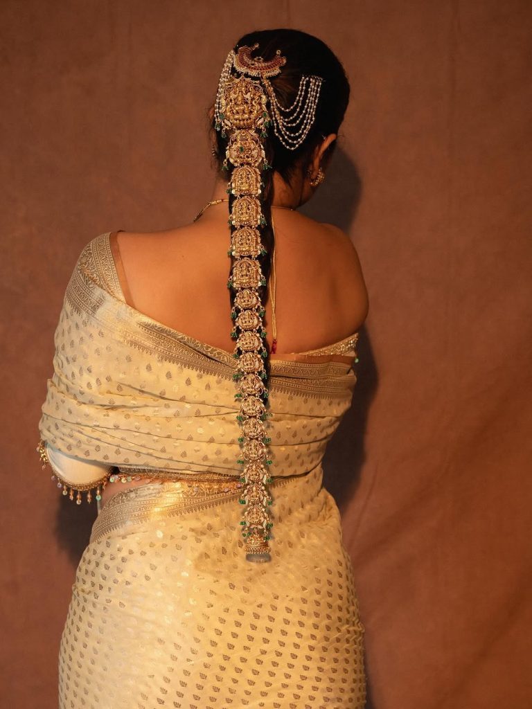 Refined white traditional wear reflects Anasuya's mature styling sense
