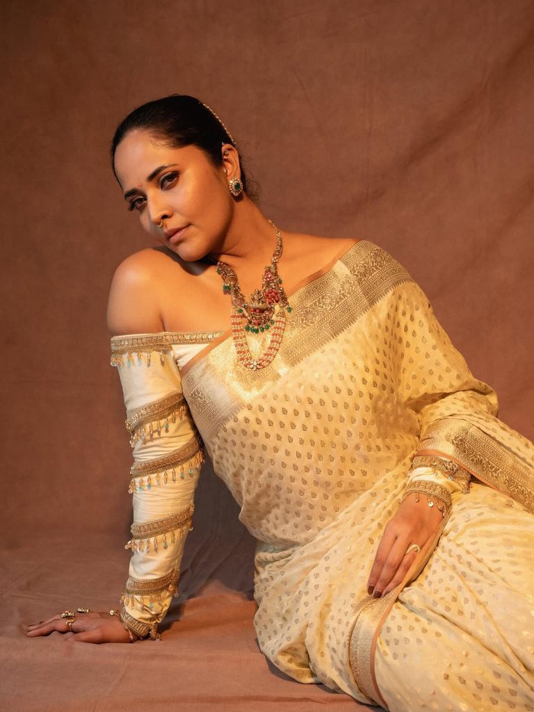 Refined white traditional wear reflects Anasuya's mature styling sense
