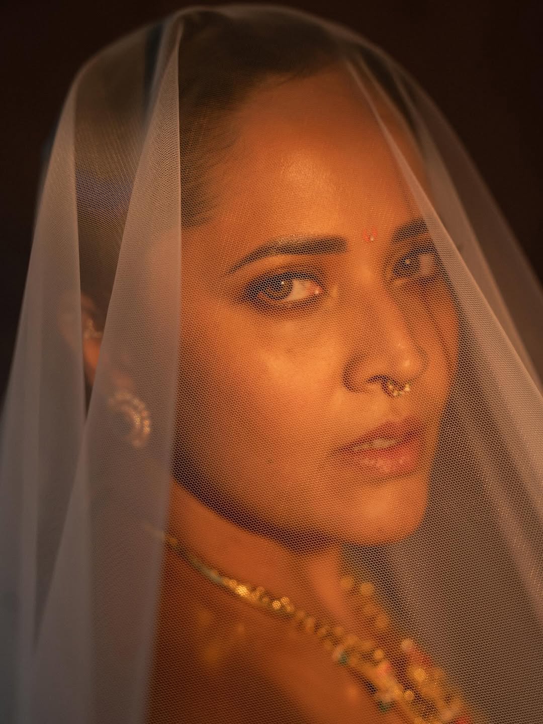 Refined white traditional wear reflects Anasuya's mature styling sense