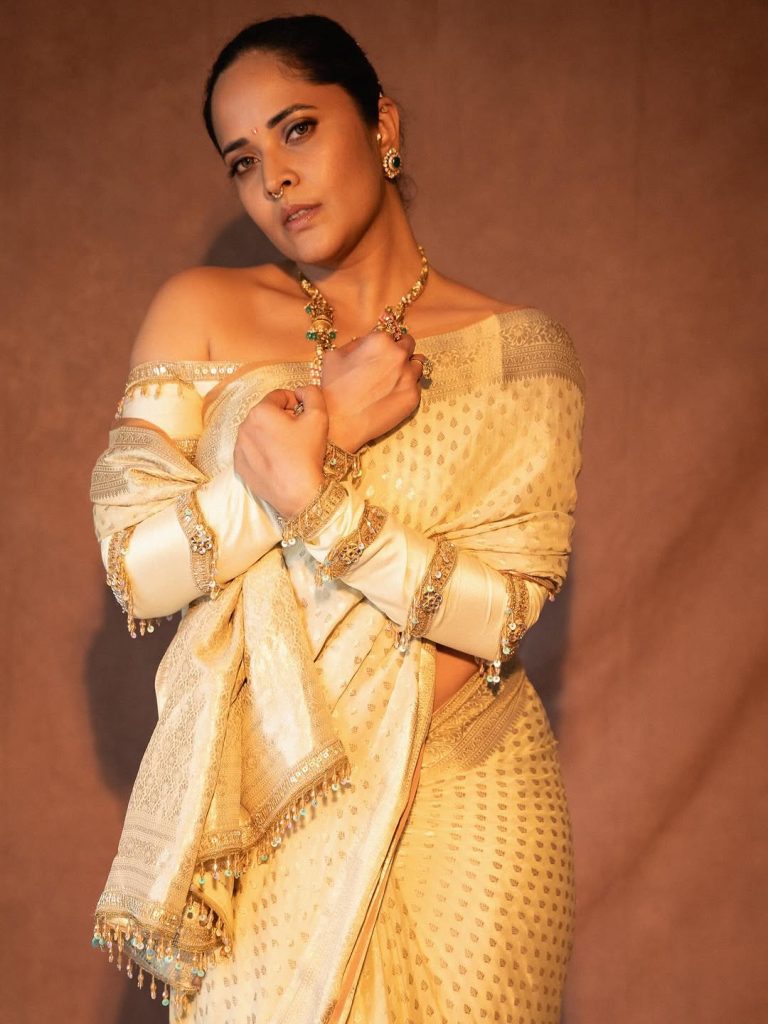 Pure white saree creates sophisticated elegance in Anasuya's traditional styling