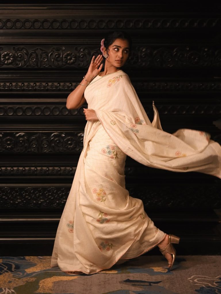 Angelic white traditional styling creates heavenly portrait effect for Anupama Parameswaran
