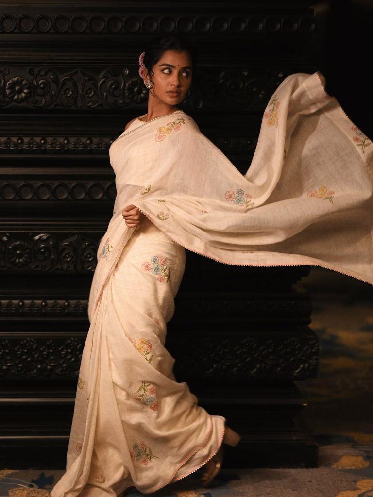 Angelic white traditional styling creates heavenly portrait effect for Anupama Parameswaran