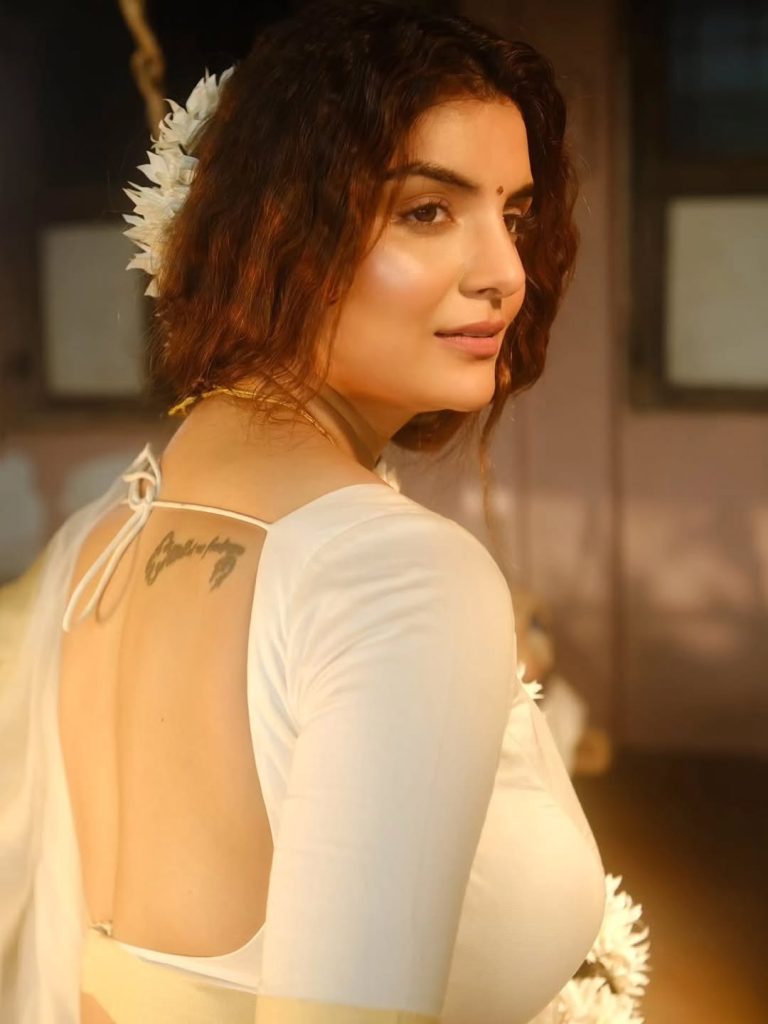 Traditional white saree styling showcases Anveshi Jain's cultural appreciation