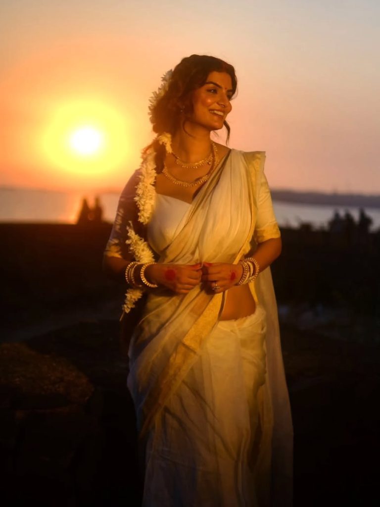 Traditional white saree styling showcases Anveshi Jain's cultural appreciation